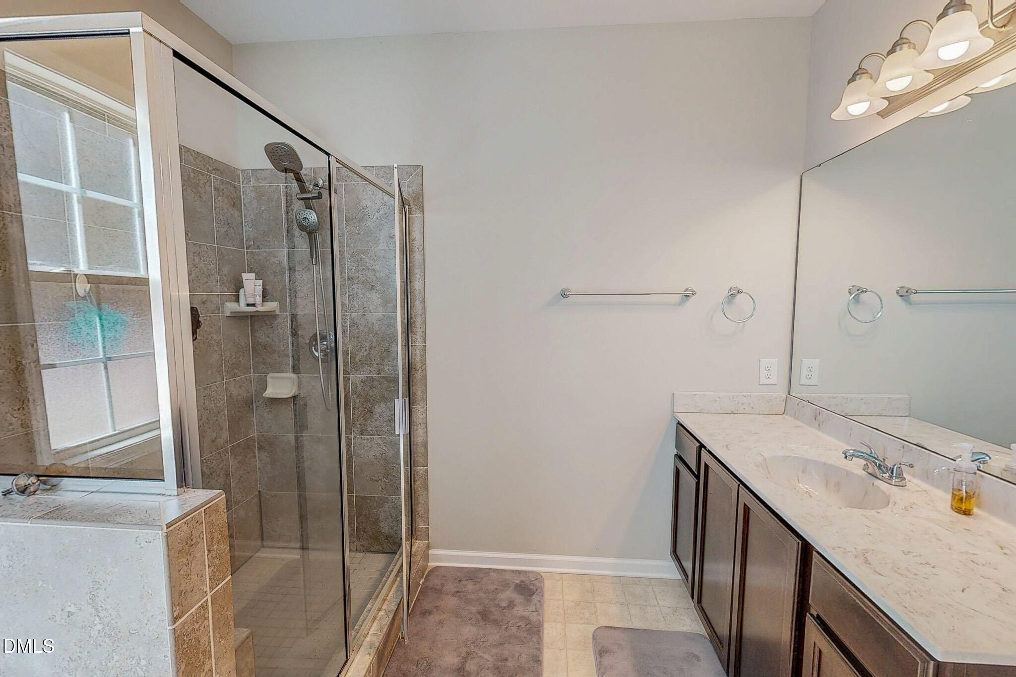 2223 Holeman Ashley Road Timberlake, NC 27583 - Photo 20 of 42 a bathroom with a sink and a mirror
