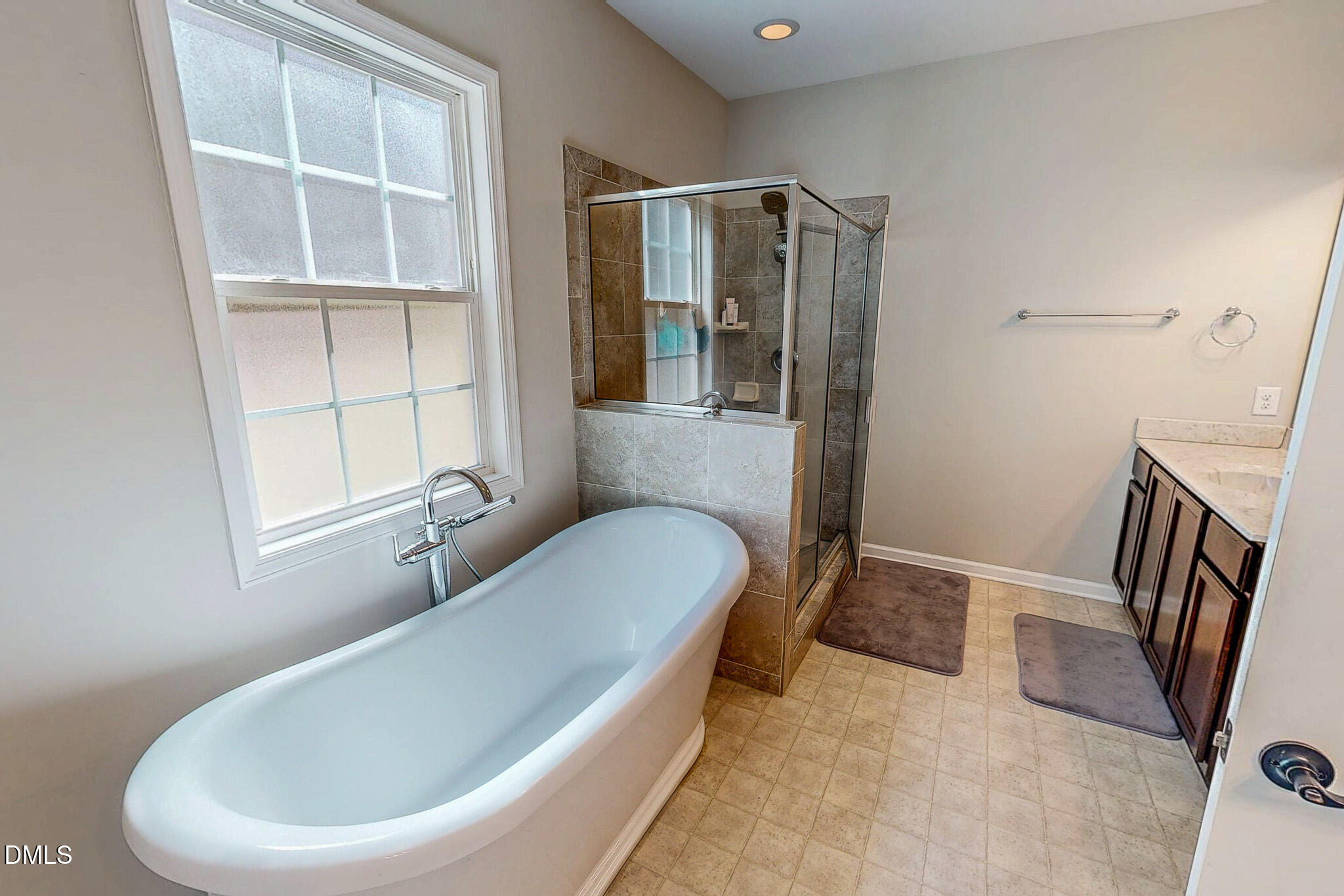 2223 Holeman Ashley Road Timberlake, NC 27583 - Photo 21 of 42 a bathroom with a tub and a window