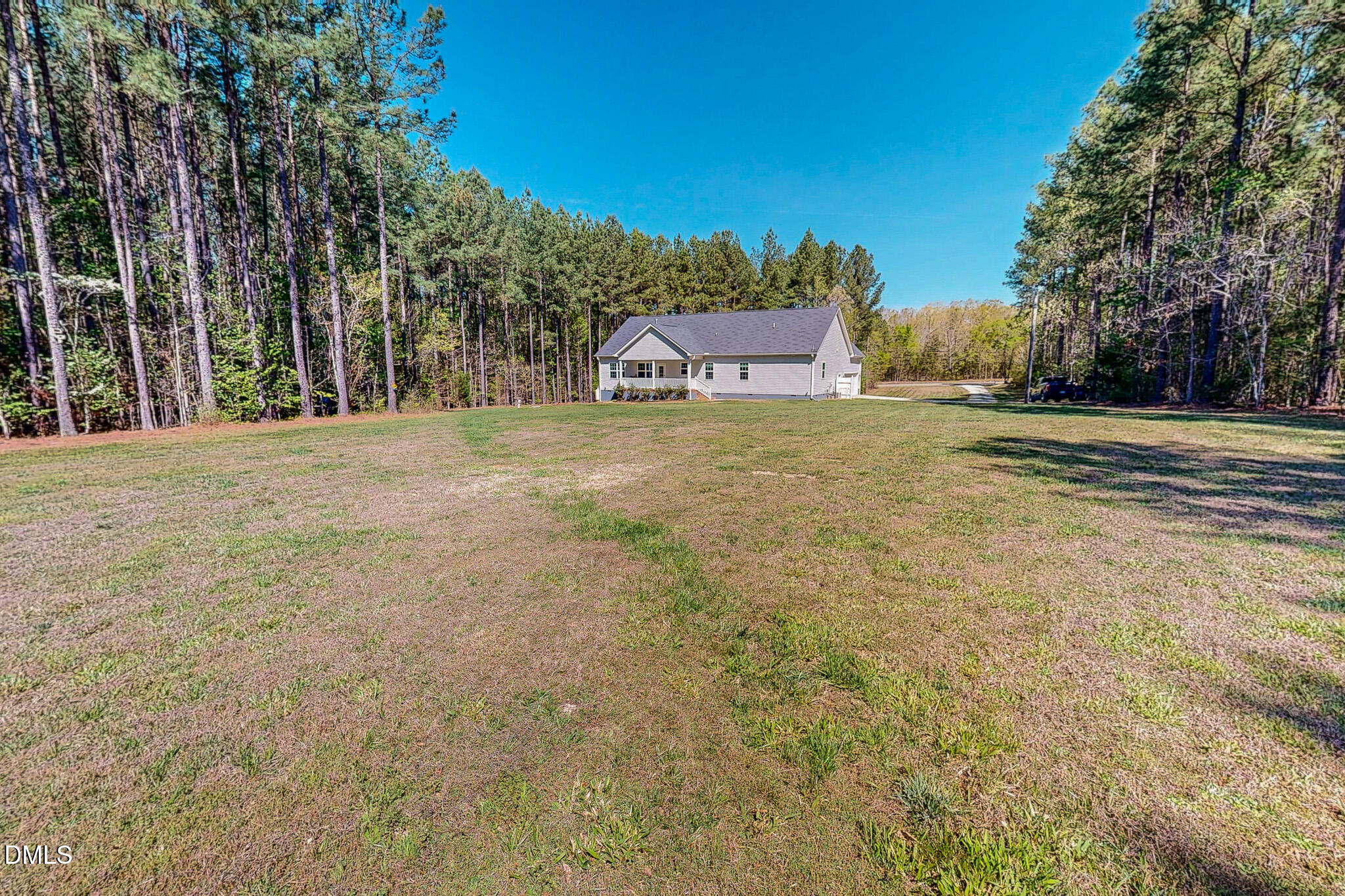 2223 Holeman Ashley Road Timberlake, NC 27583 - Photo 22 of 42 a front view of a house with a yard and trees