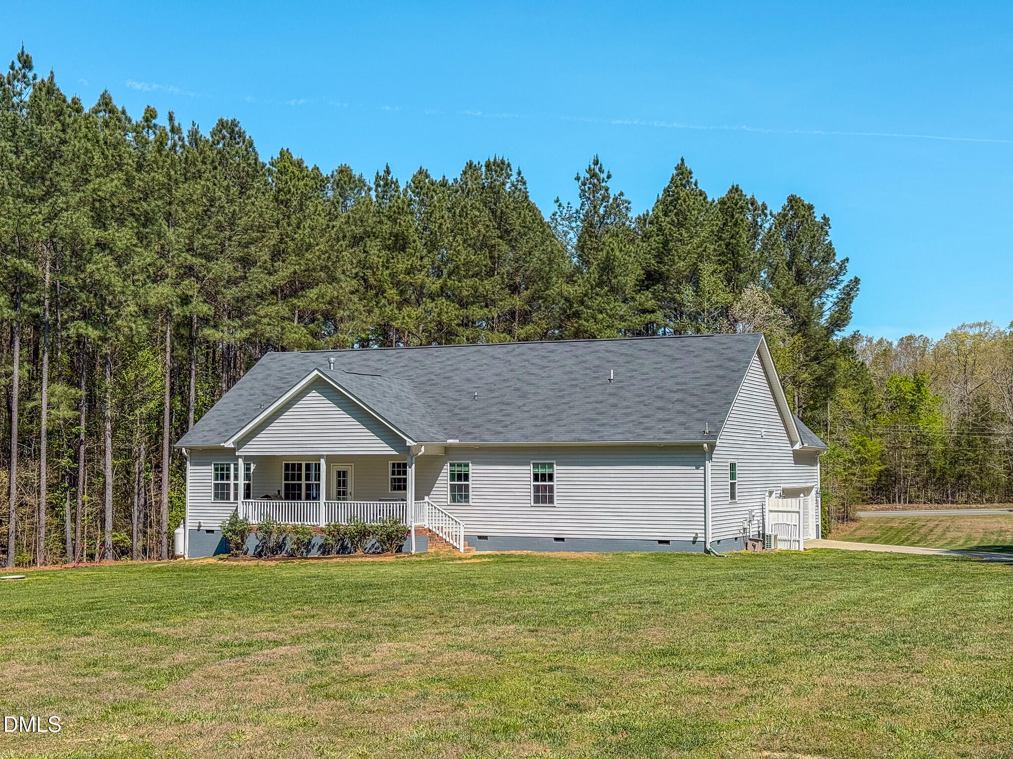 2223 Holeman Ashley Road Timberlake, NC 27583 - Photo 24 of 42 a front view of a house with a garden