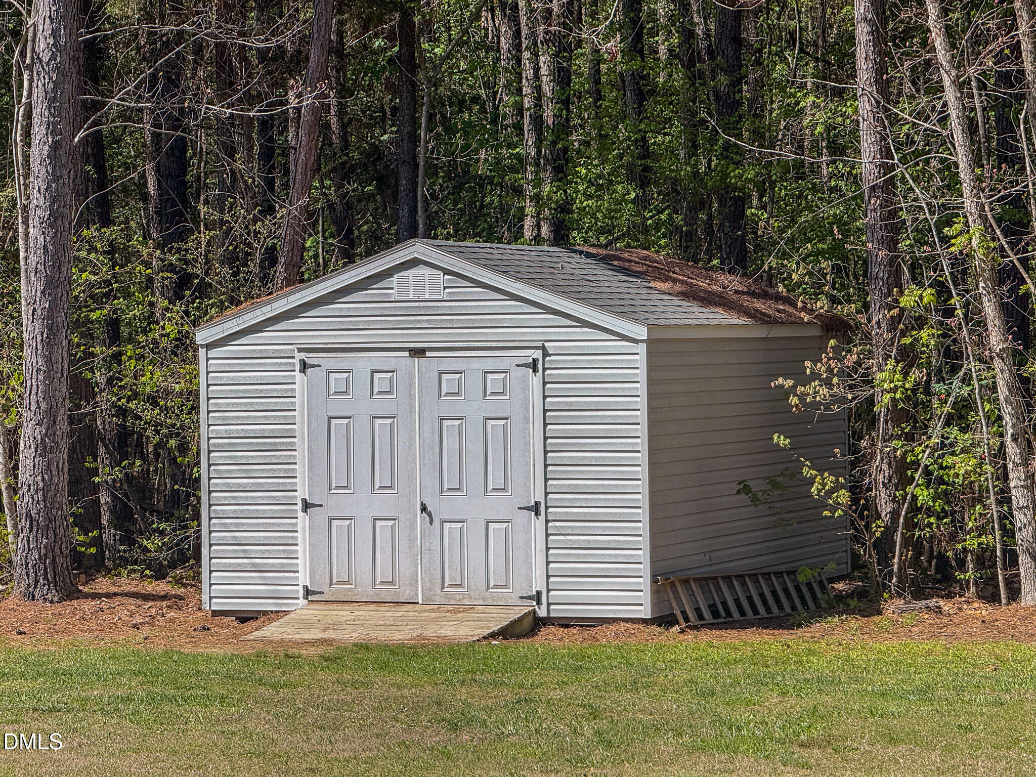 2223 Holeman Ashley Road Timberlake, NC 27583 - Photo 25 of 42 a front view of a house with garden