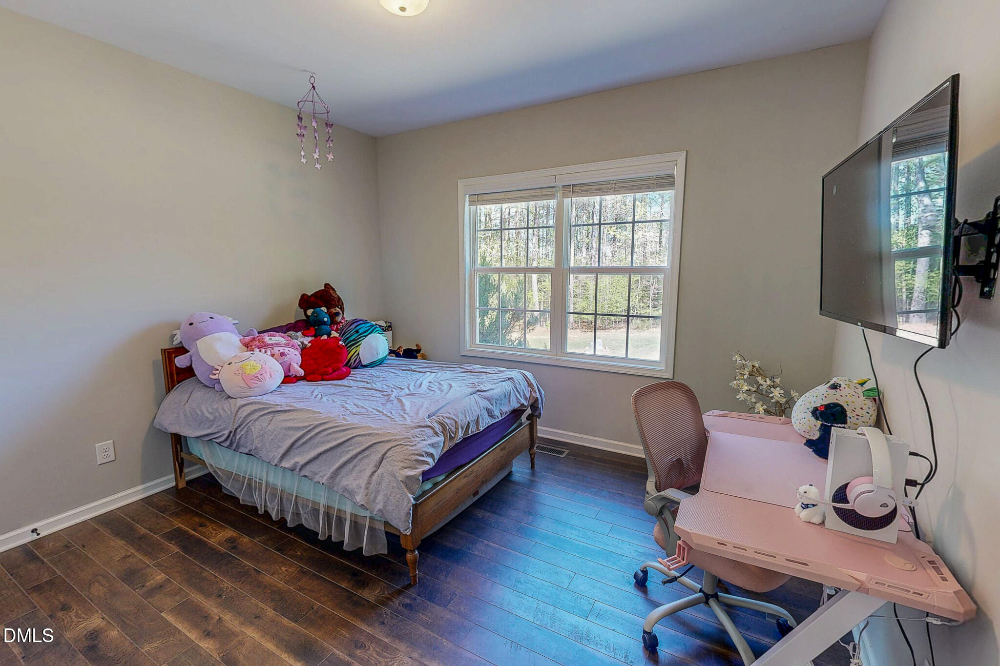 2223 Holeman Ashley Road Timberlake, NC 27583 - Photo 33 of 42 a bedroom with a bed and wooden floor