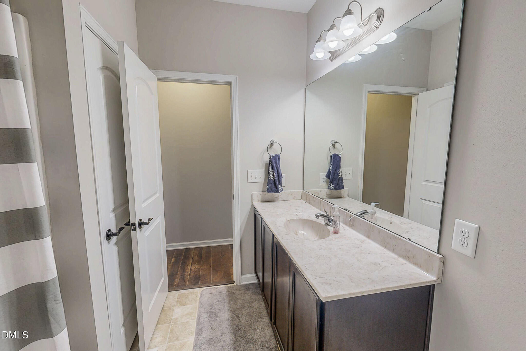 2223 Holeman Ashley Road Timberlake, NC 27583 - Photo 37 of 42 a bathroom with a sink a vanity and a mirror