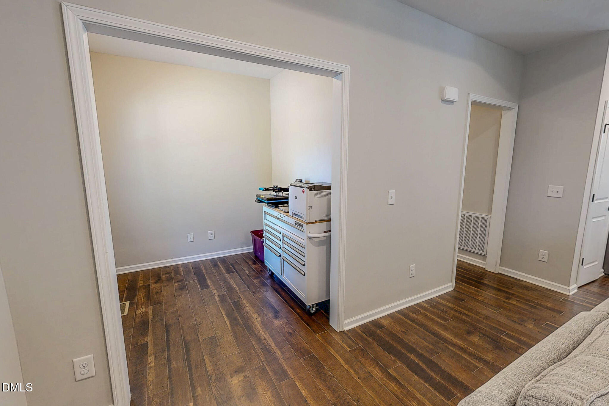 2223 Holeman Ashley Road Timberlake, NC 27583 - Photo 41 of 42 a view of an empty room with wooden floor and a window