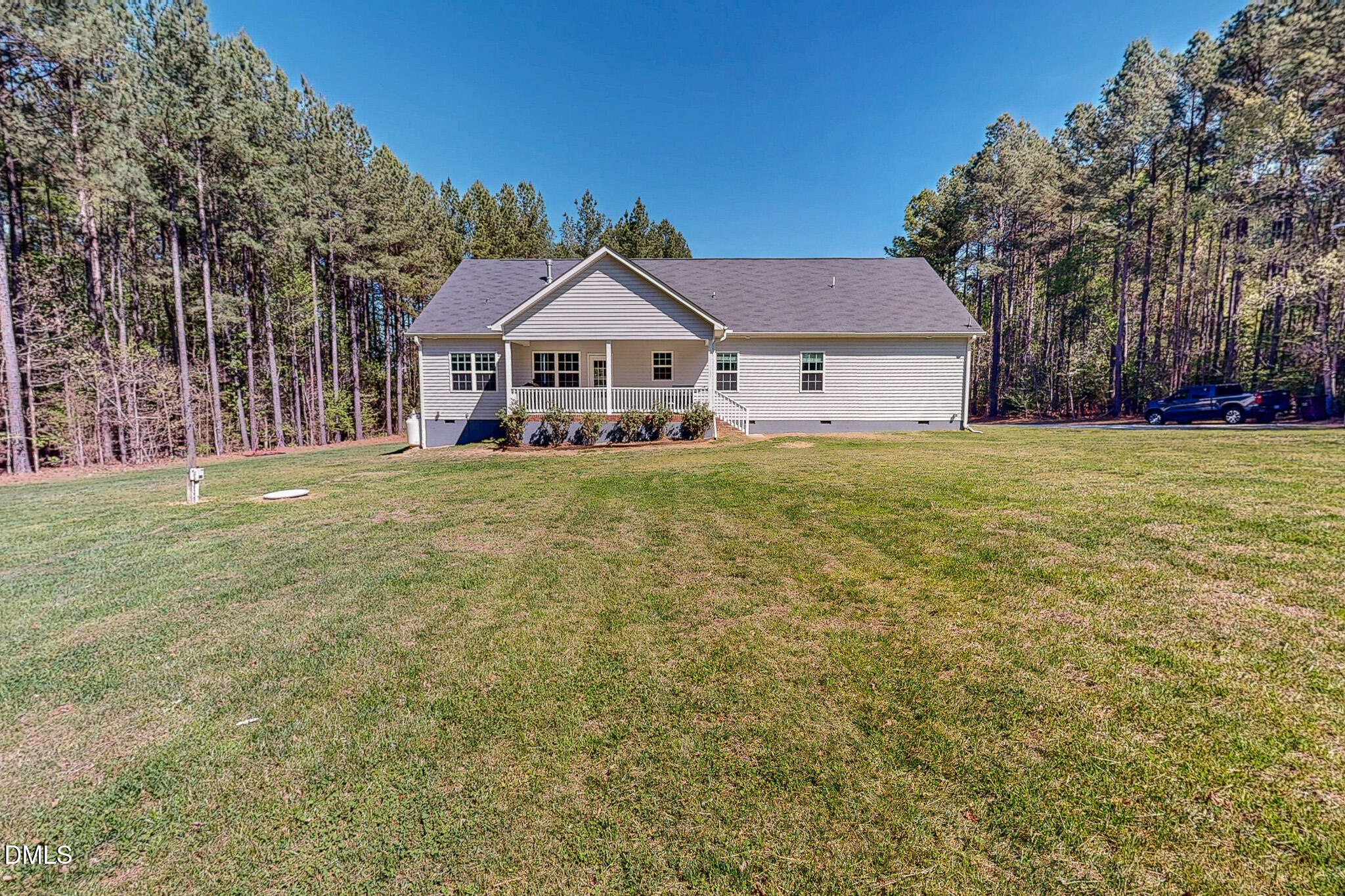 2223 Holeman Ashley Road Timberlake, NC 27583 - Photo 7 of 42 a front view of a house with a yard
