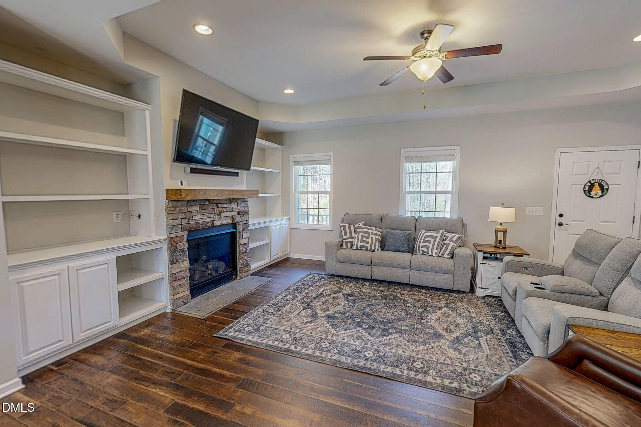 2223 Holeman Ashley Road Timberlake, NC 27583 - Photo 9 of 42 a living room with furniture and a fireplace