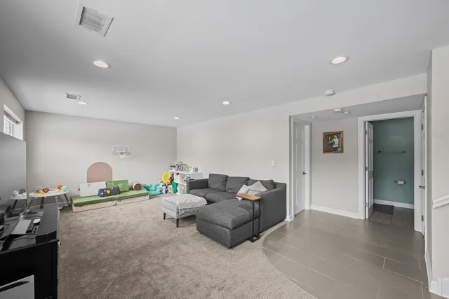 a living room with furniture and a couch