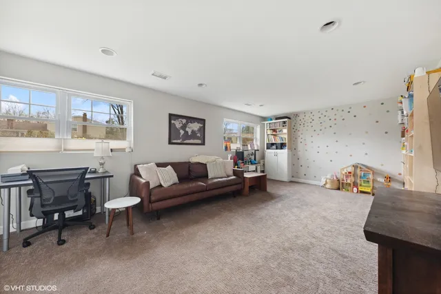 a living room with furniture and a table