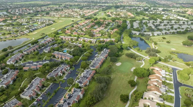 a view of swimming pool with outdoor seating and plants