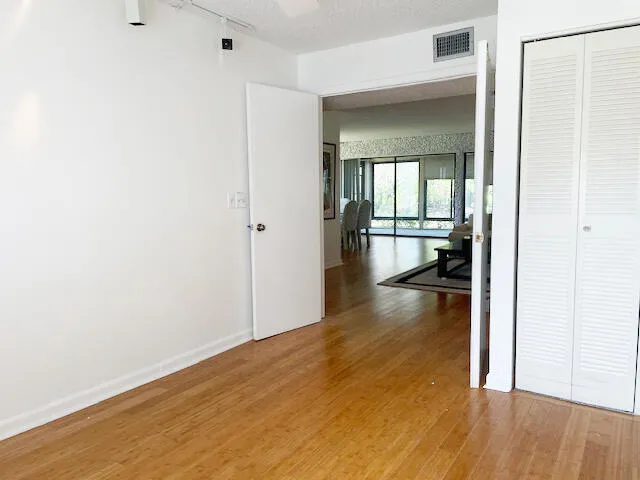 a view of an empty room and a window