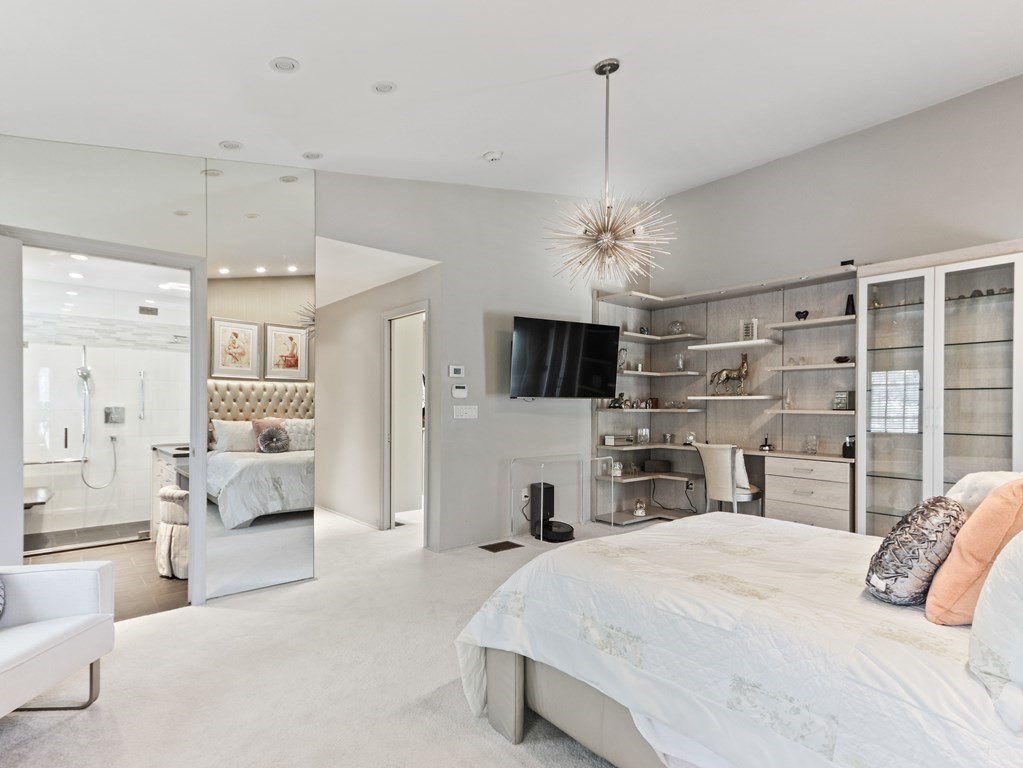 325 Manning Street Needham, MA 02492 - Photo 18 of 31 a bedroom with a bed and flat screen tv