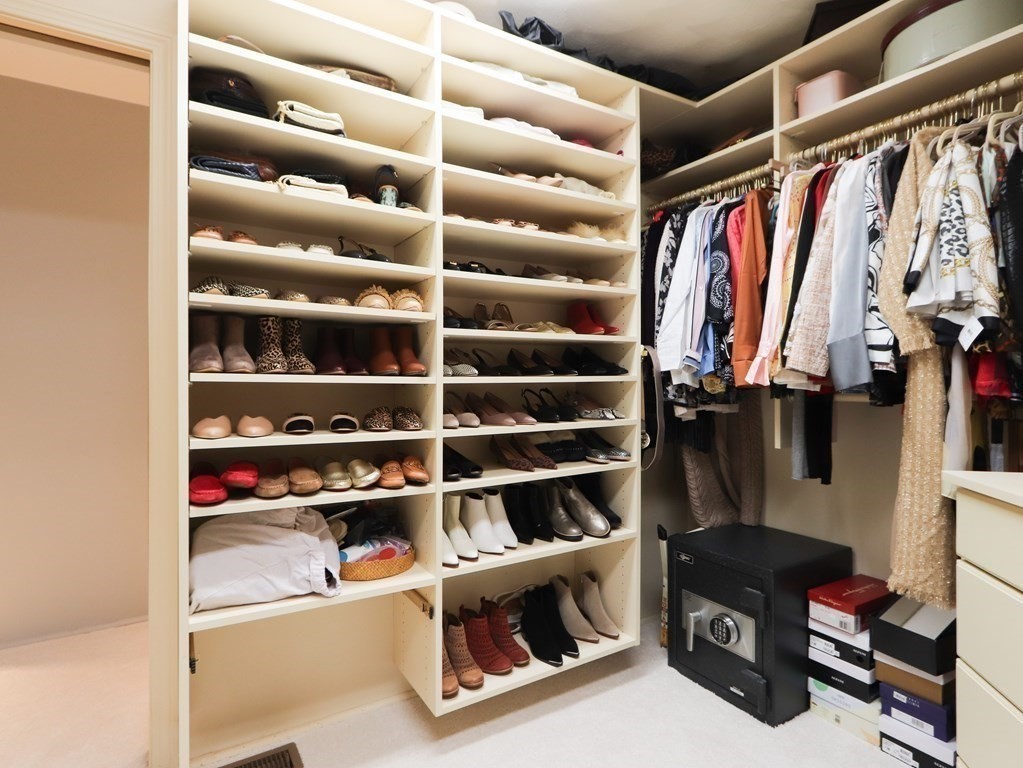 325 Manning Street Needham, MA 02492 - Photo 20 of 31 a view of walk in closet with clothes and shoes