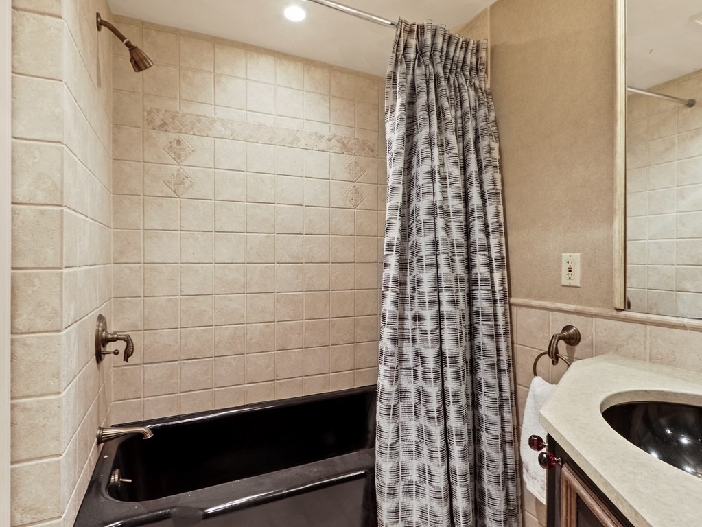 325 Manning Street Needham, MA 02492 - Photo 23 of 31 a bathroom with a sink and a shower