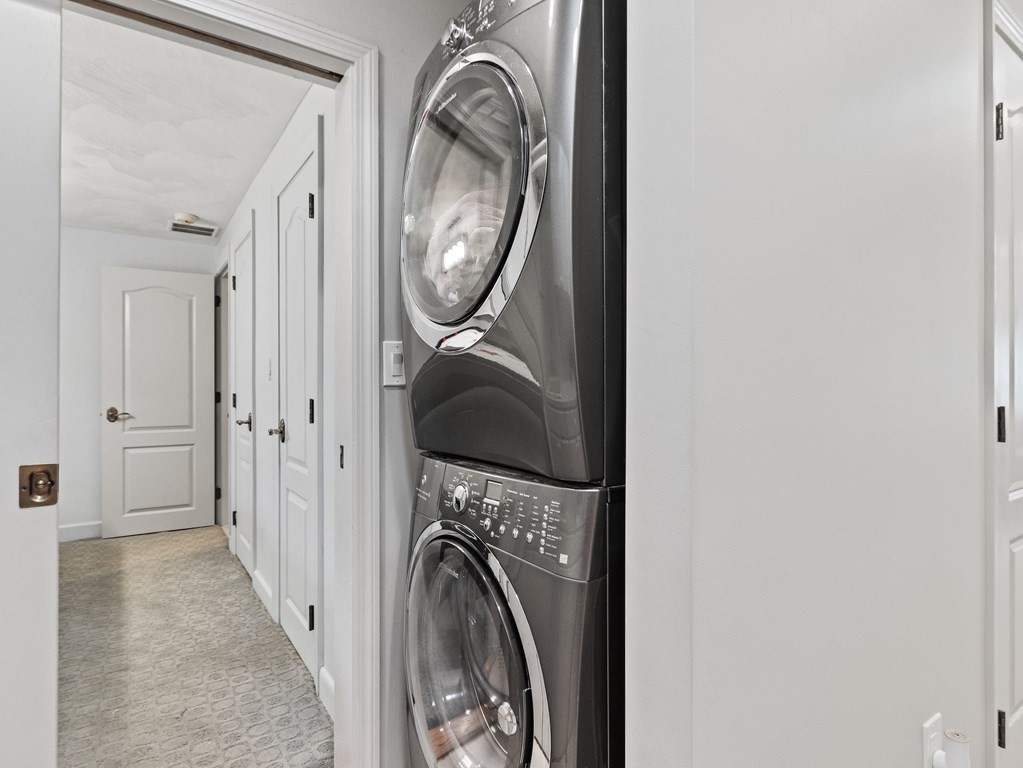 325 Manning Street Needham, MA 02492 - Photo 24 of 31 a view of a hallway with washer and dryer