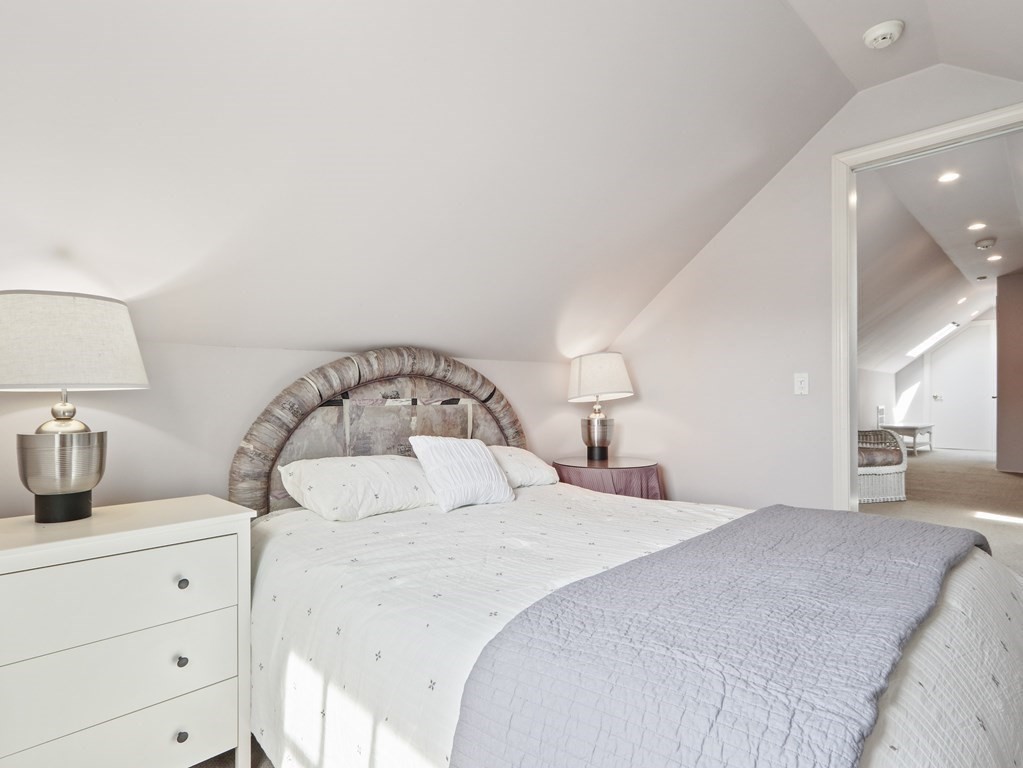 325 Manning Street Needham, MA 02492 - Photo 26 of 31 a bedroom with a bed and a lamp on dresser