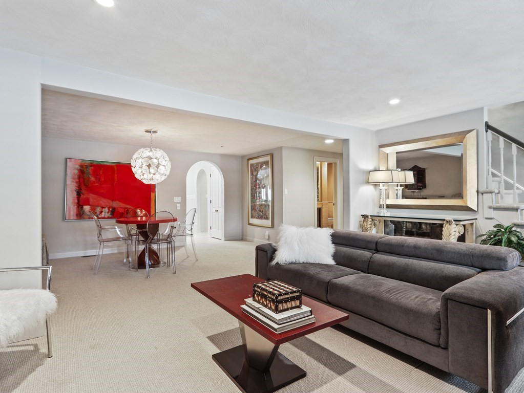 325 Manning Street Needham, MA 02492 - Photo 7 of 31 a living room with furniture a rug and a chandelier