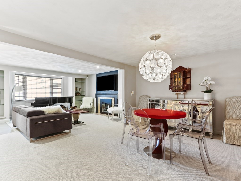 325 Manning Street Needham, MA 02492 - Photo 8 of 31 a living room with furniture a rug and a large window