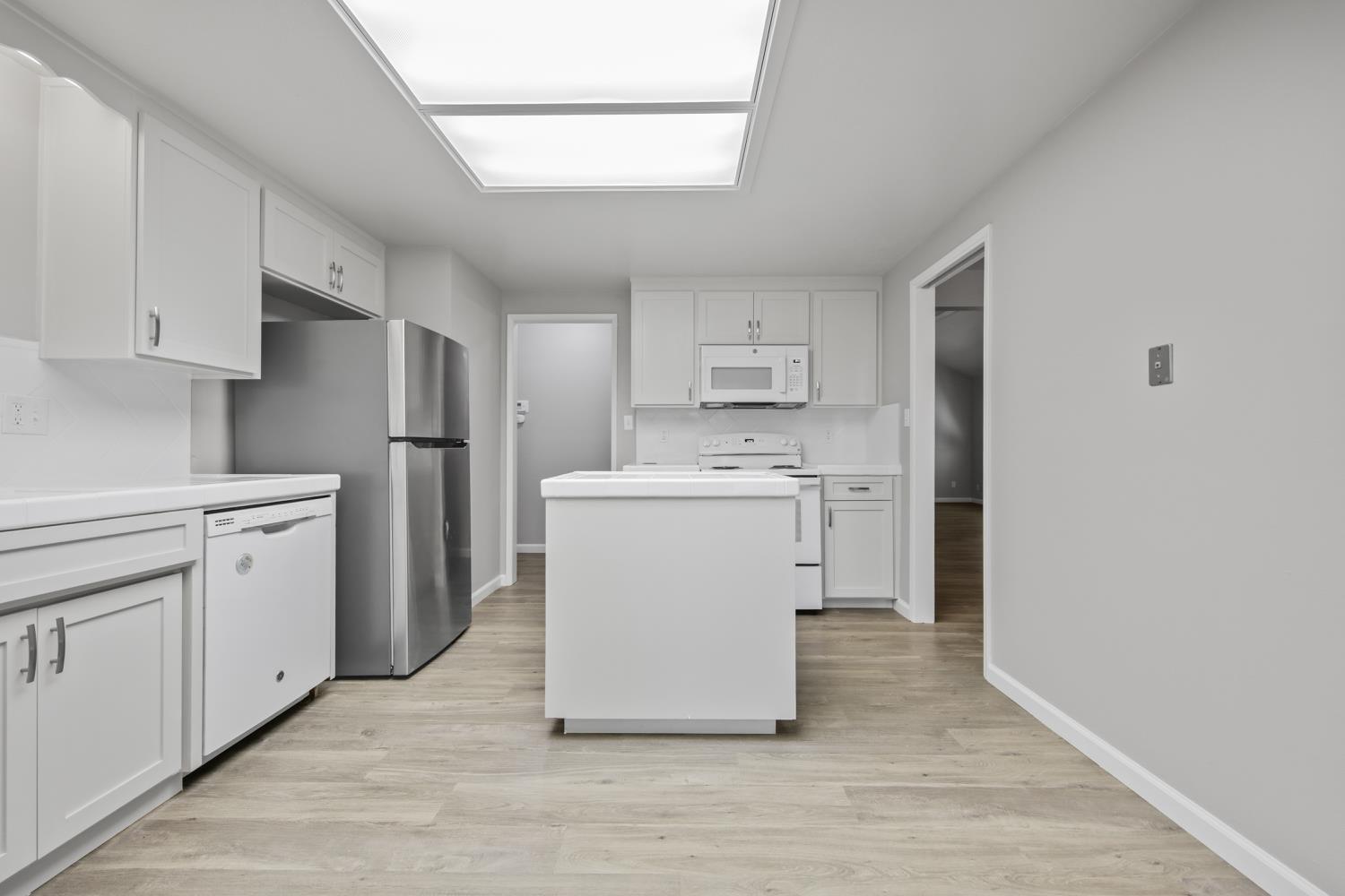 1001 West Lincoln Road, Unit A Stockton, CA 95207 - Photo 12 of 32 a utility room with cabinets washer and dryer