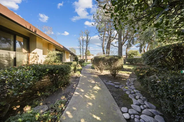 a view of a pathway with a yard