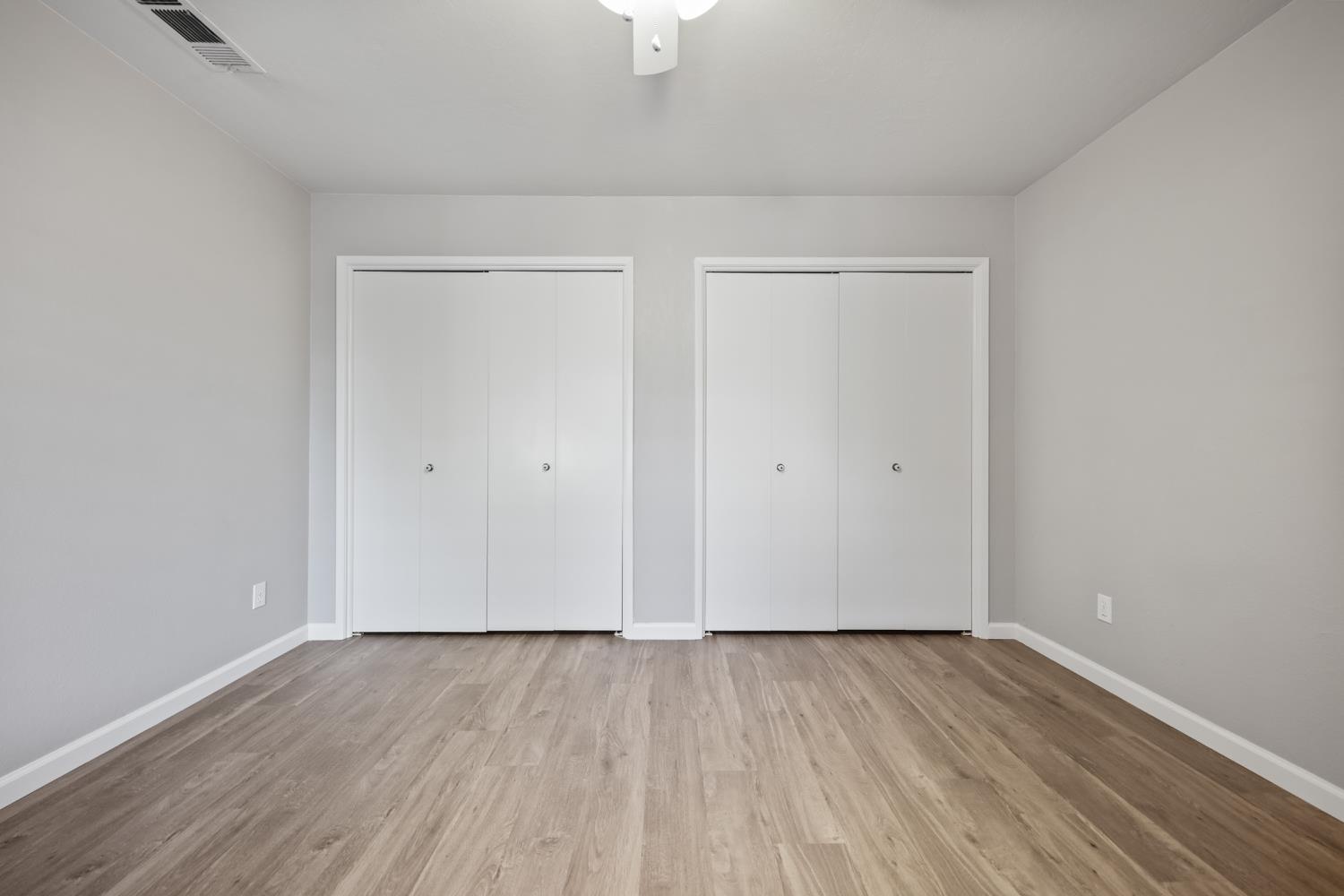 1001 West Lincoln Road, Unit A Stockton, CA 95207 - Photo 25 of 32 a view of an empty room with wooden floor