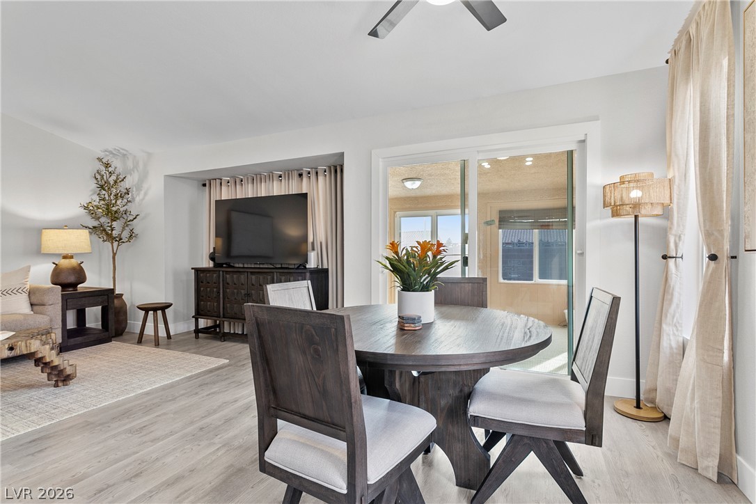 101 Beaver Ridge Avenue North Las Vegas, NV 89031 - Photo 11 of 42 Blends seamlessly with the living area, this dining space boasts smooth wood flooring and access to a sun-filled outdoor area.