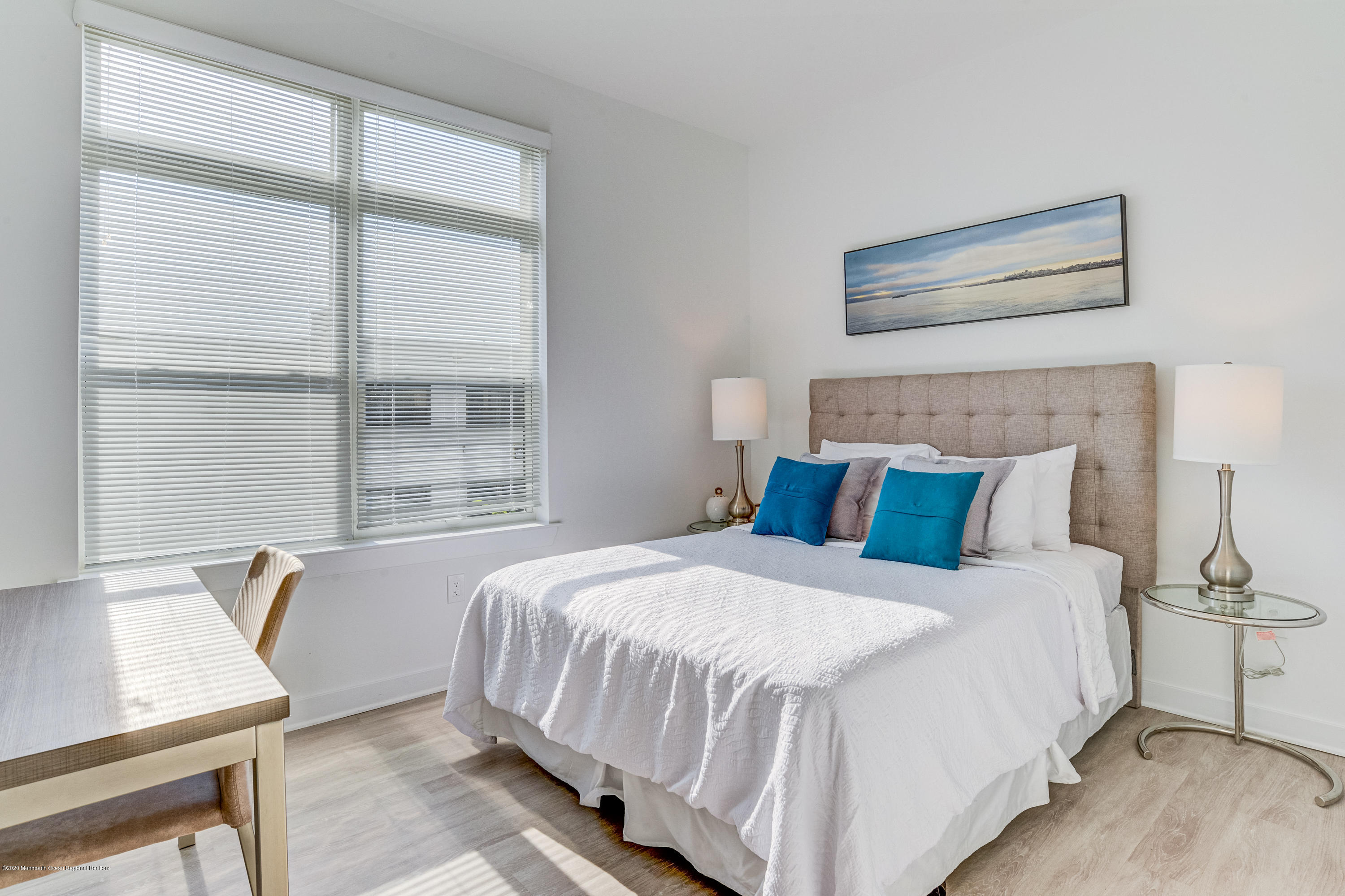 55 West Front Street, Unit 201 Red Bank, NJ 07701 - Photo 19 of 26 a bedroom with a bed and a window