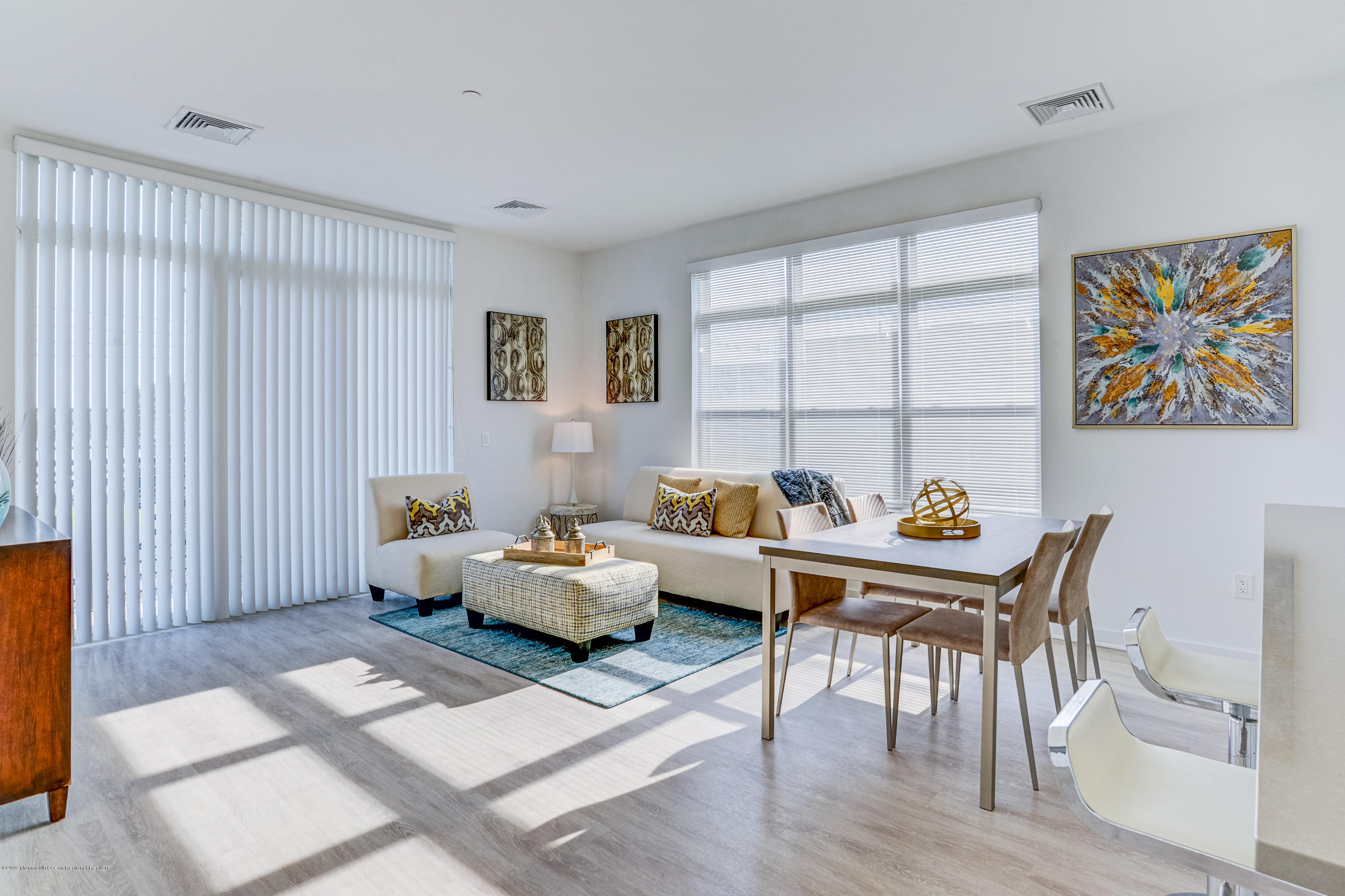 55 West Front Street, Unit 201 Red Bank, NJ 07701 - Photo 7 of 26 a living room with furniture and a window with wooden floor