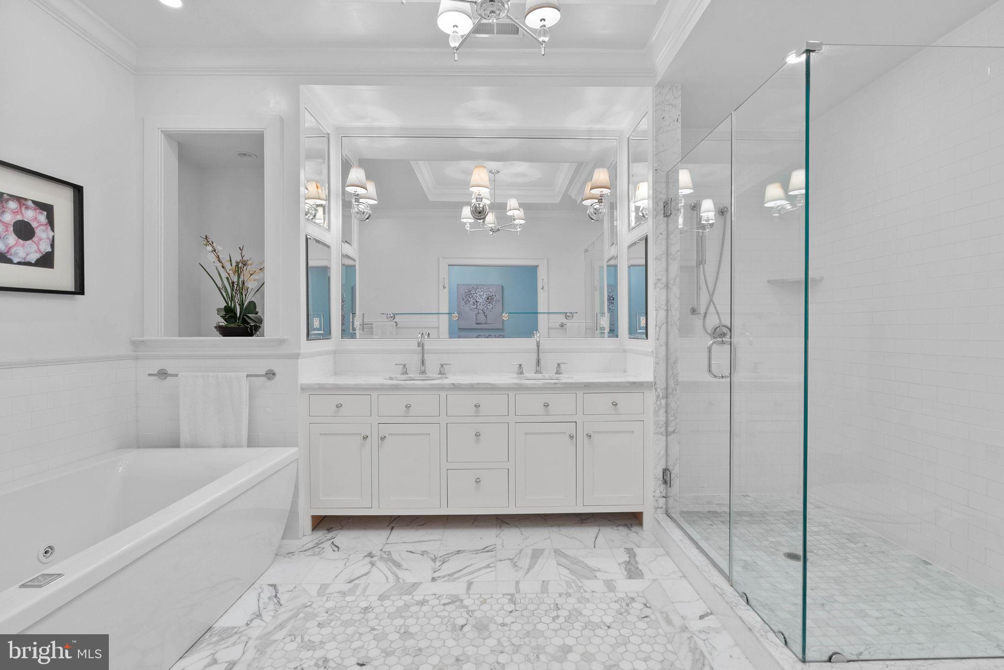 2019 Rittenhouse Square Philadelphia, PA 19103 - Photo 25 of 54 a spacious bathroom with a double vanity sink a mirror a bathtub and a shower