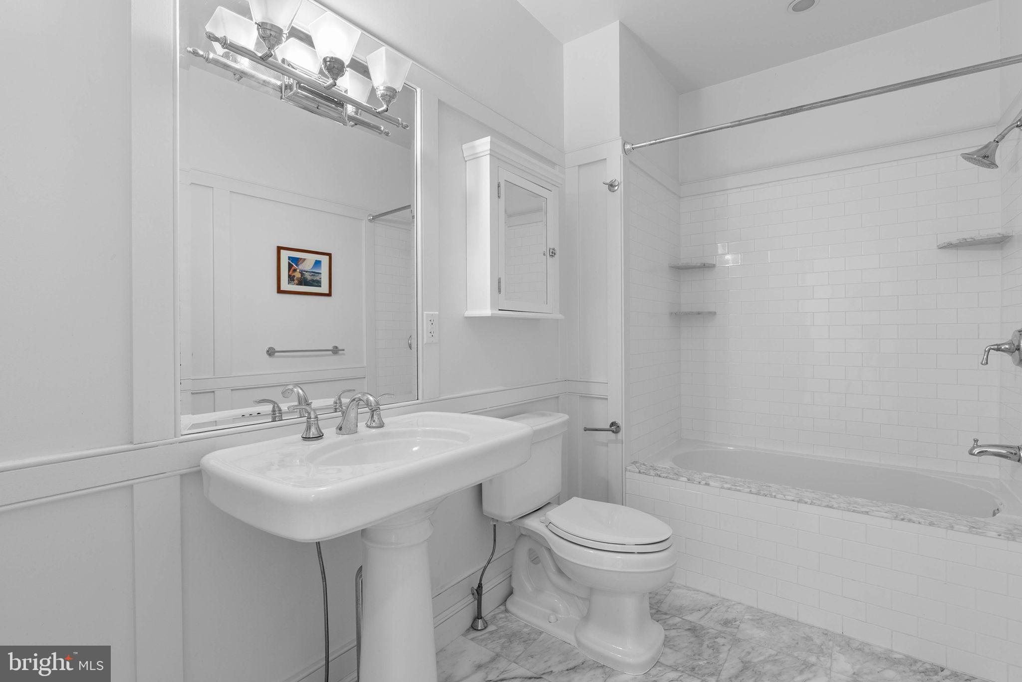 2019 Rittenhouse Square Philadelphia, PA 19103 - Photo 38 of 54 a bathroom with a sink toilet and shower
