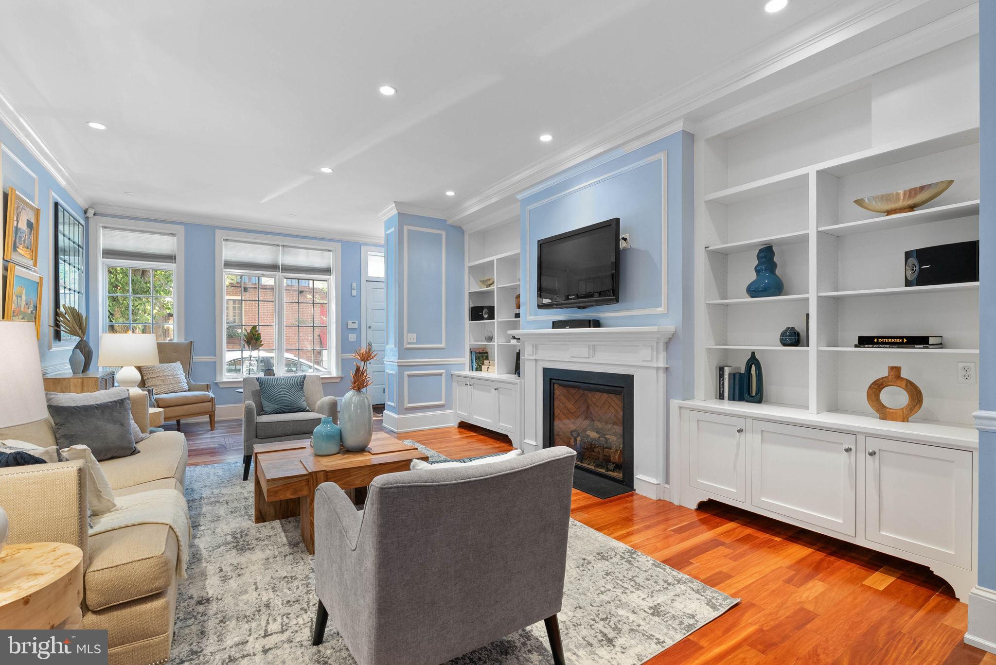 2019 Rittenhouse Square Philadelphia, PA 19103 - Photo 5 of 54 a living room with furniture a flat screen tv and a fireplace