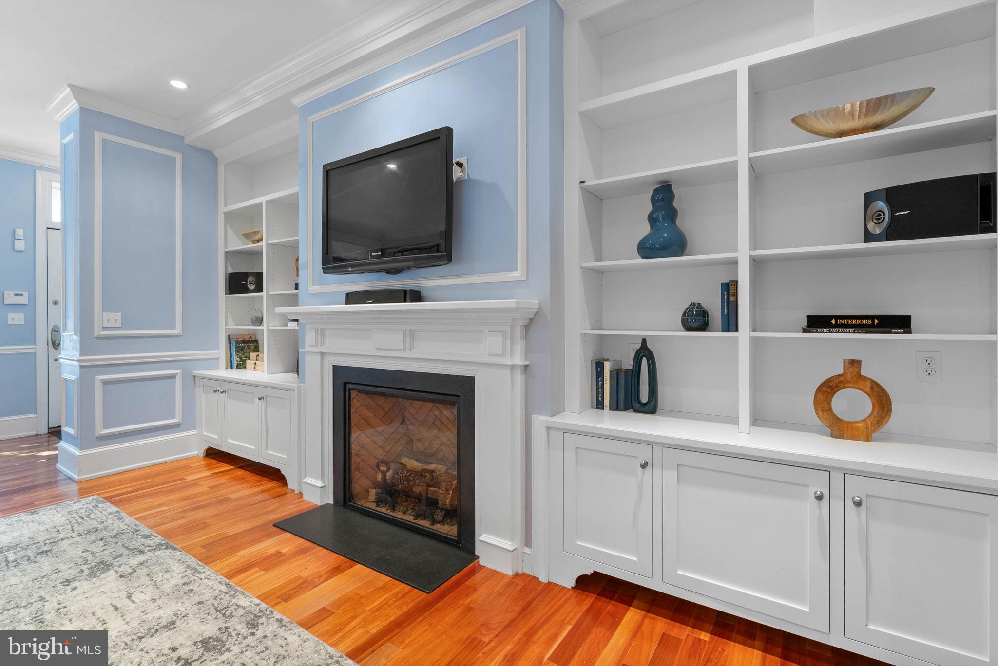 2019 Rittenhouse Square Philadelphia, PA 19103 - Photo 6 of 54 a living room with a fireplace and a flat screen tv