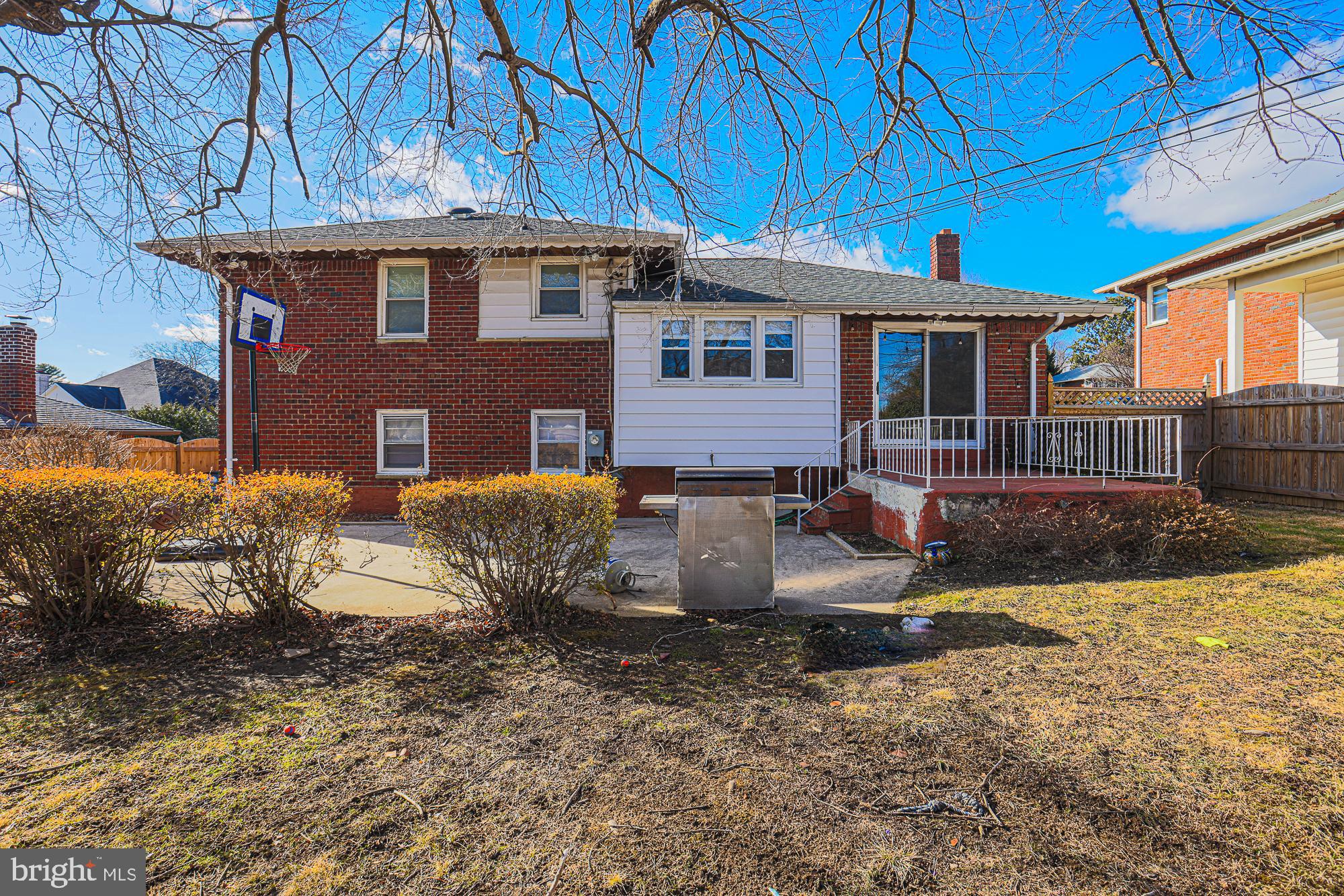 6605 Deancroft Road Baltimore, MD 21209 - Photo 5 of 31 a front view of a house with garden