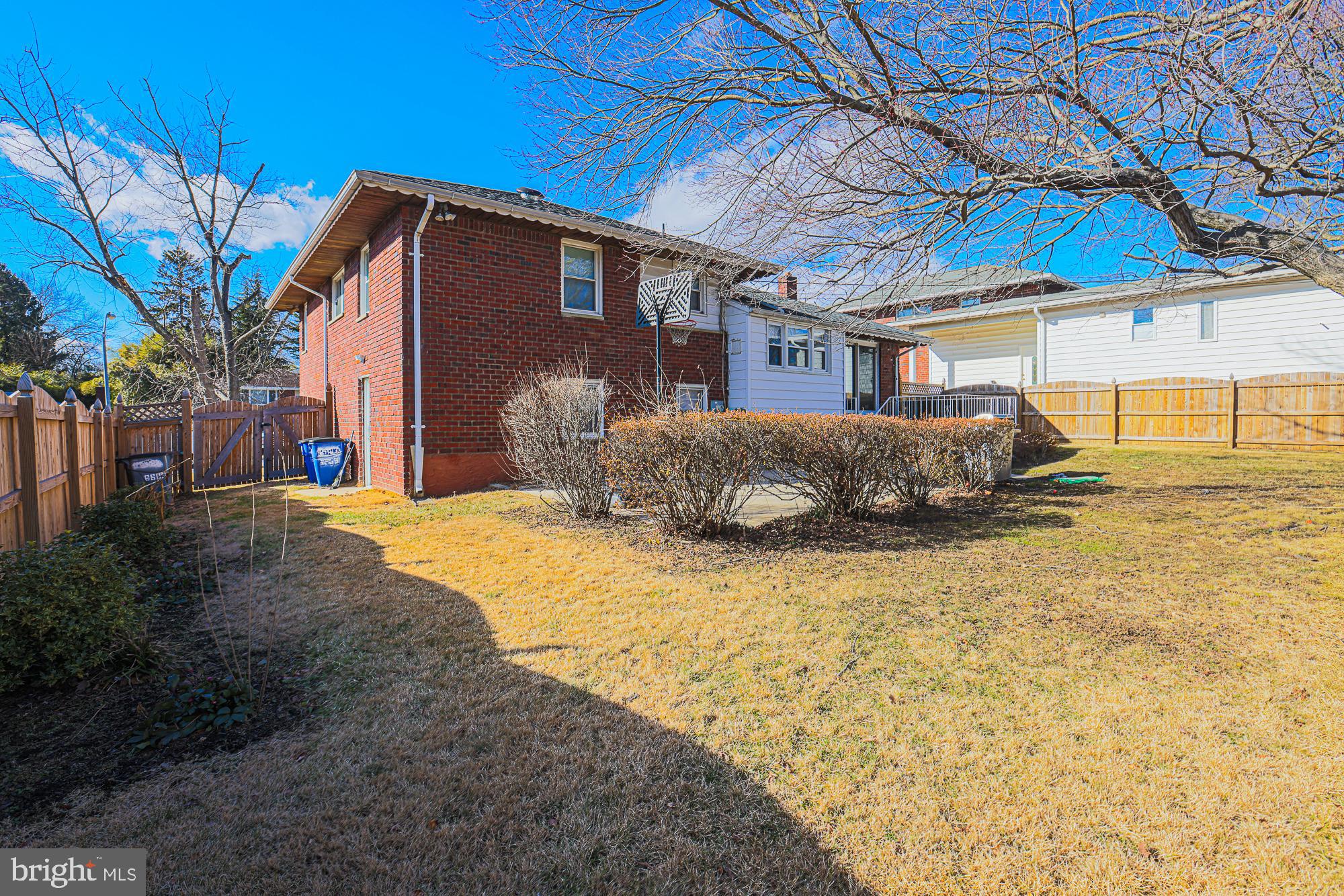 6605 Deancroft Road Baltimore, MD 21209 - Photo 6 of 31 a front view of a house with a yard