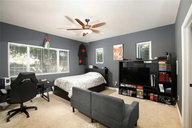 a bedroom with a workspace