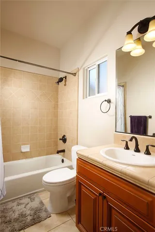 a bathroom with a sink a toilet and a bathtub