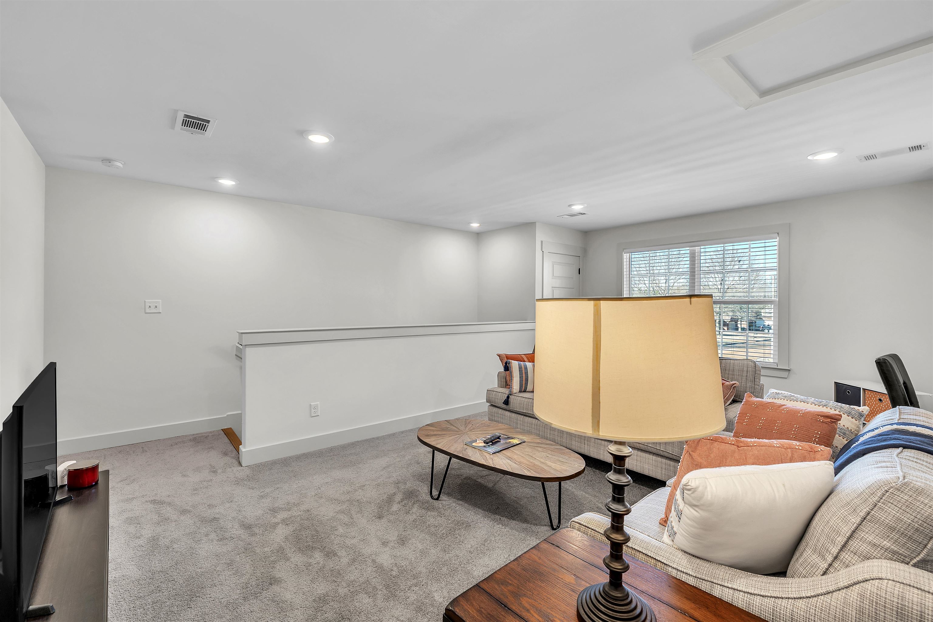 5592 Gerber Road Arlington, TN 38002 - Photo 13 of 28 a living room with furniture and a flat screen tv