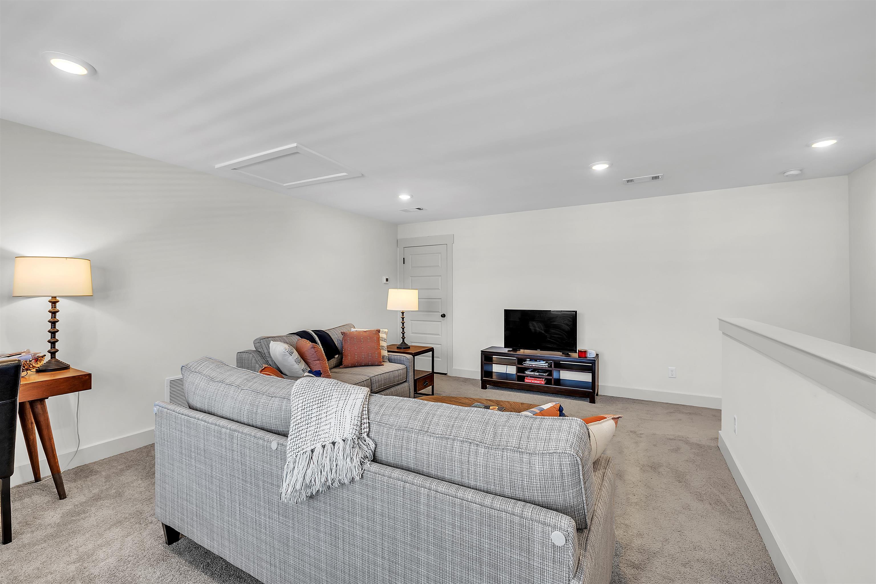 5592 Gerber Road Arlington, TN 38002 - Photo 19 of 28 a living room with furniture a flat screen tv and a fireplace