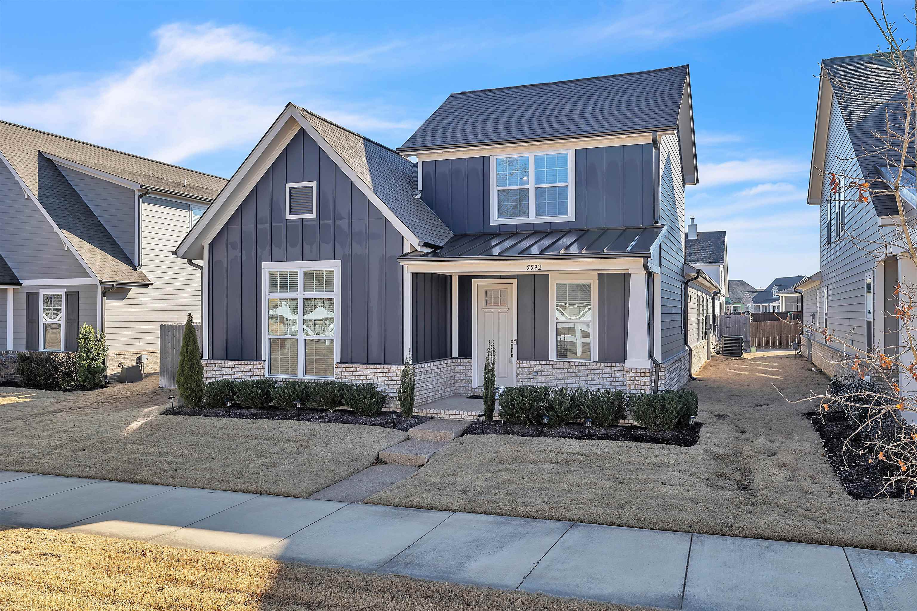 5592 Gerber Road Arlington, TN 38002 - Photo 2 of 28 a front view of a house with a yard