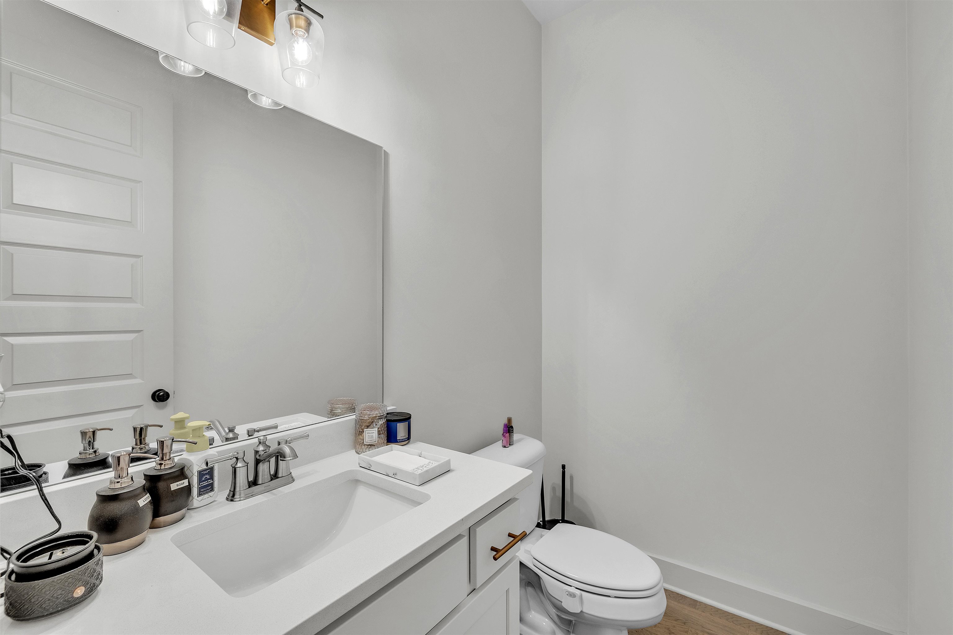 5592 Gerber Road Arlington, TN 38002 - Photo 23 of 28 a bathroom with a sink a toilet and mirror