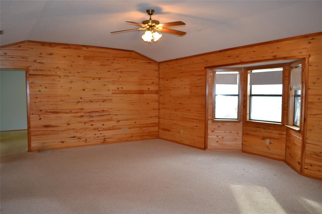 213 County Road 1997 Yantis, TX 75497 - Photo 12 of 28 wooden floor in an empty room