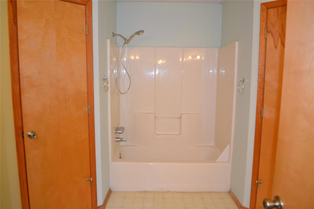 213 County Road 1997 Yantis, TX 75497 - Photo 19 of 28 a bathroom with a bathtub