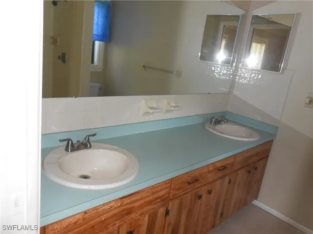 a white toilet sitting next to a window