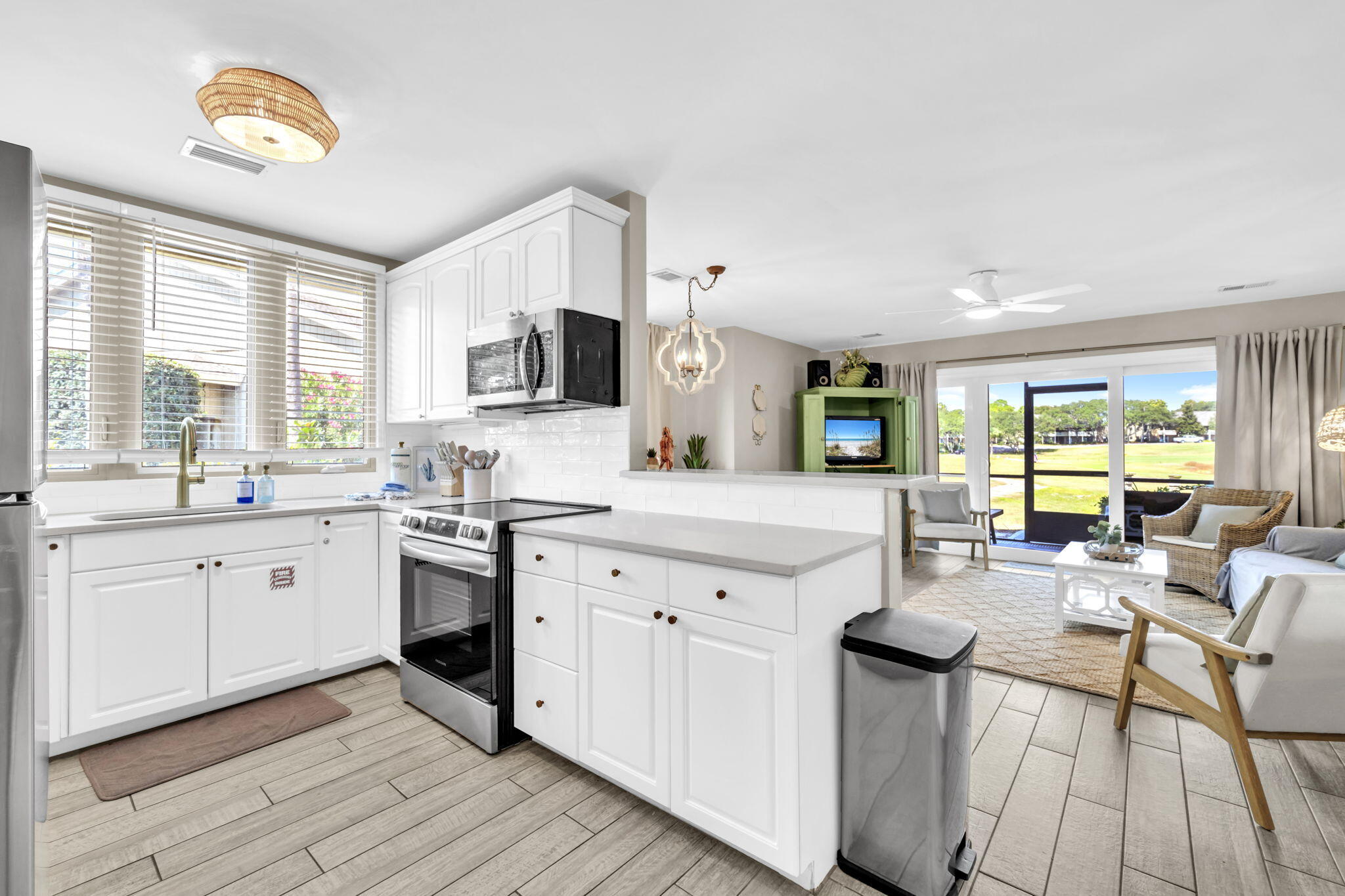 a kitchen with a sink cabinets and window