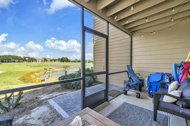 a view of a balcony with chair and table