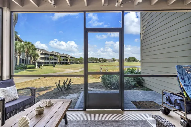 a view of a balcony with wooden floor