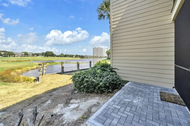 a view of a lake with a yard