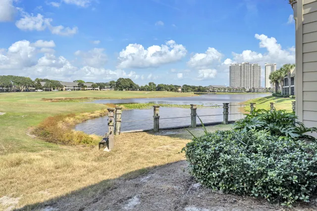 a view of a hallway with windows and stairs