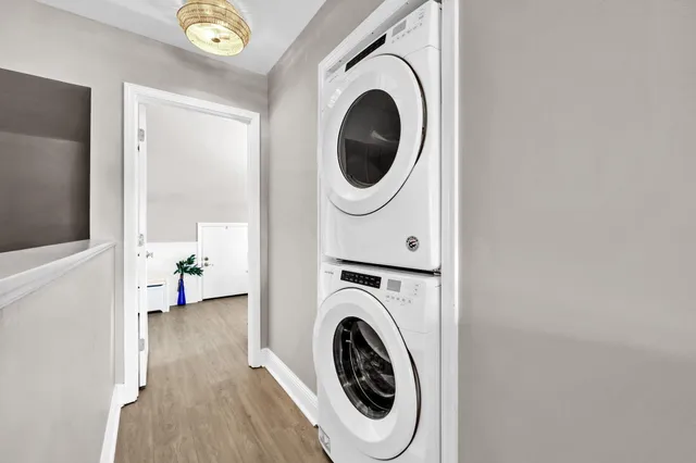 a bedroom with a bed and a potted plant