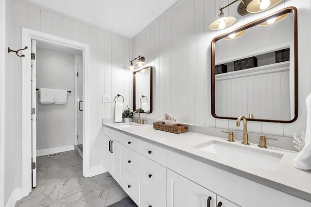 a view of a balcony with wooden floor and outdoor seating