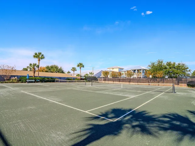 a view of a swimming pool with an outdoor seating